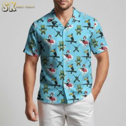 Blue hawaiian shirt with flamingos wearing hats, tiki masks, and tropical bird pattern