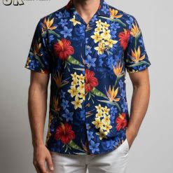 Blue Hawaiian shirt displaying red, yellow, and orange tropical flowers against dark blue fabric