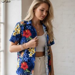 Blue hibiscus Hawaiian shirt showing red hibiscus flowers mixed with yellow and orange tropical blooms