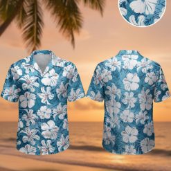 Blue hibiscus Hawaiian shirt featuring large white hibiscus flowers with red stamens on blue background