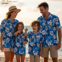 Blue hibiscus hawaiian shirt featuring large white hibiscus flowers with yellow centers and tropical leaf designs