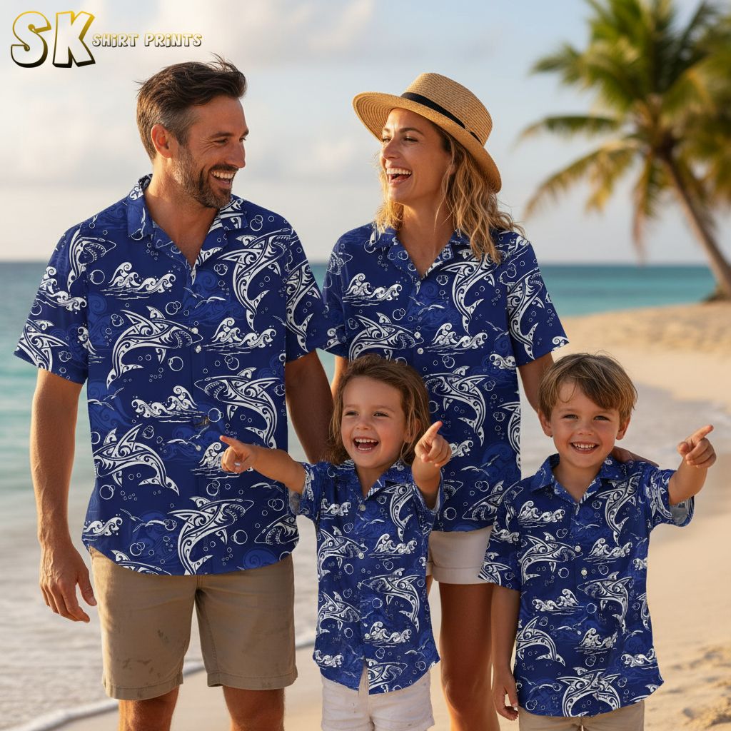 Blue tropical shirt featuring stylized white dolphins and ocean waves with artistic line patterns and bubble accents