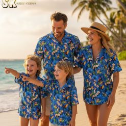 Blue tropical shirt showcasing exotic parrots, toucans, and tropical flowers in bright orange and white colors