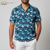 Blue tropical shirt displaying flamingo birds among tropical leaves in white and black accents