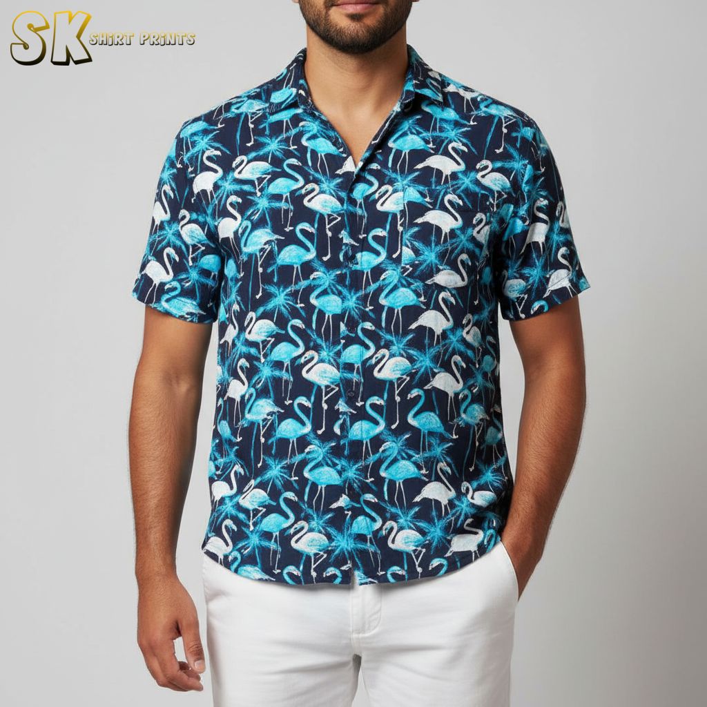 Blue tropical shirt displaying flamingo birds among tropical leaves in white and black accents