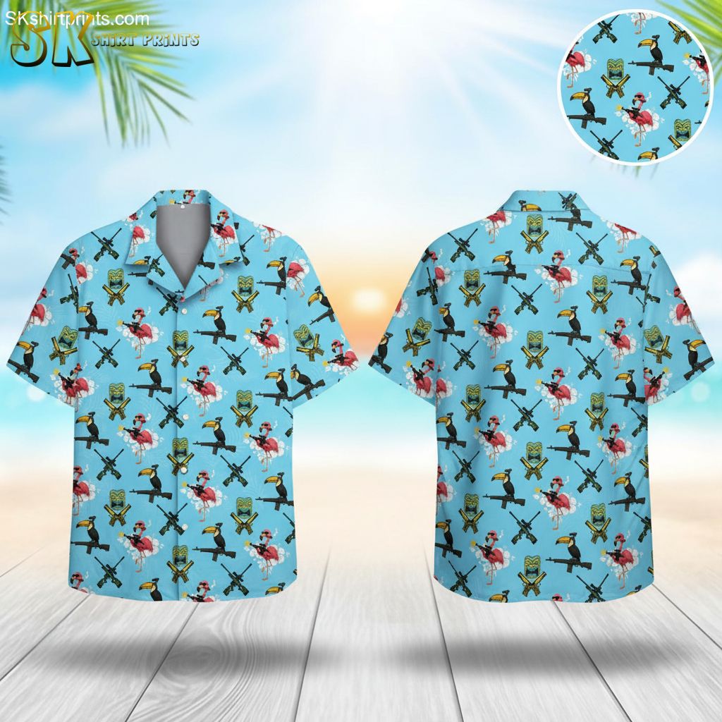 Blue tropical shirt featuring flamingos wearing sunglasses, toucans on rifles, and tiki masks on light blue background