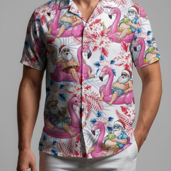 Christmas vacation Hawaiian shirt showing Santa in beach attire with sunglasses holding drinks on flamingo floats