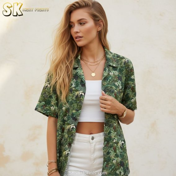 Dark green hawaiian shirt featuring jungle leaf print with dense tropical vegetation pattern