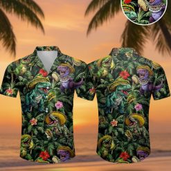 DnD Hawaiian shirt featuring cartoonish dinosaurs wearing sombreros and holding tacos with tropical hibiscus flowers