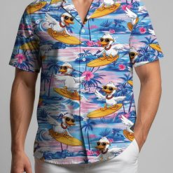 Donald Duck Hawaiian shirt with surfing ducks wearing sunglasses on yellow surfboards among palm trees and hibiscus flowers