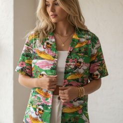 Duck button up shirt featuring cartoon ducks with accessories surfing on boards with tropical flower details