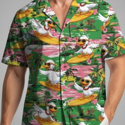 Duck Hawaiian shirt with cartoon ducks on surfboards surrounded by palm trees and hibiscus flowers