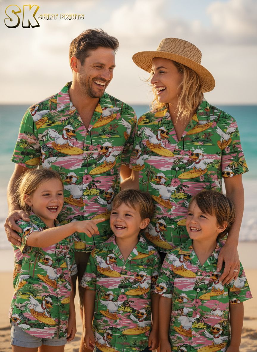 Duck print shirt showing cartoon ducks wearing sunglasses surfing yellow boards with tropical flower accents