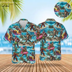 Flamingo aloha shirt featuring Bigfoot surfing and tropical beach scenes