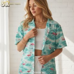Flamingo aloha shirt displaying pink flamingos among tropical palm trees and greenery