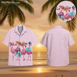 Pink flamingo Hawaiian shirt featuring four flamingos wearing sunglasses, hats, and flower garlands on pastel pink background