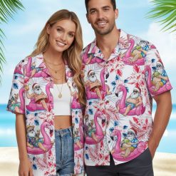 Funny Christmas Hawaiian shirts with humorous Santa character on pink flamingos holding tropical cocktails amid colorful flowers