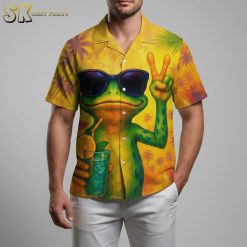 Funny tropical shirt with green frog character wearing sunglasses holding tropical cocktail on vibrant yellow background