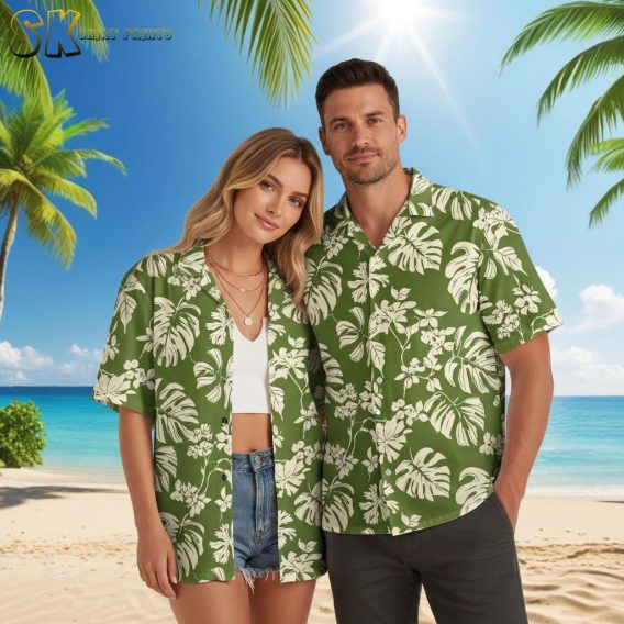 Green aloha shirt displaying botanical leaf print with flower clusters in cream tones