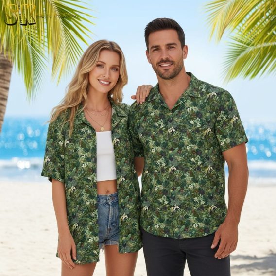 Green aloha shirt with tropical foliage design featuring dense leaf patterns and botanical elements