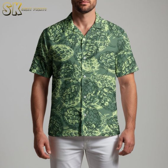 Green Hawaiian shirt with detailed artichoke leaf pattern creating textured tropical design