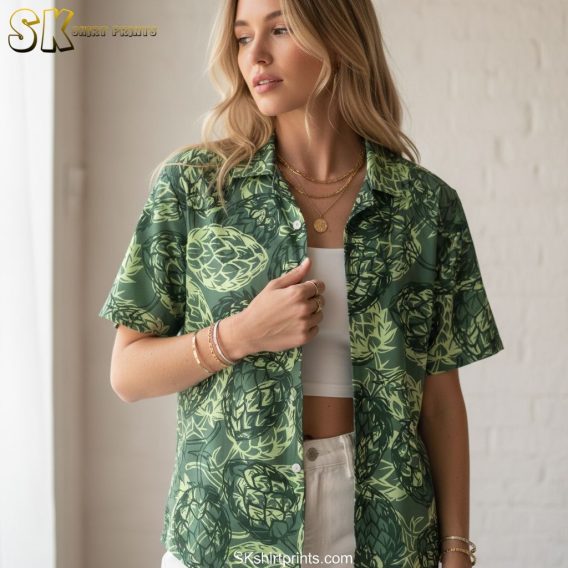 Green Hawaiian shirt for men with artichoke pattern showing detailed leaf textures against darker background