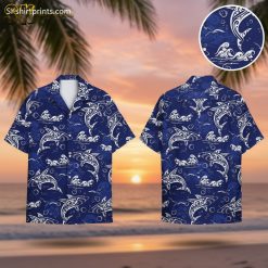 Light blue Hawaiian shirt featuring white dolphins and swirling ocean wave patterns with bubble details
