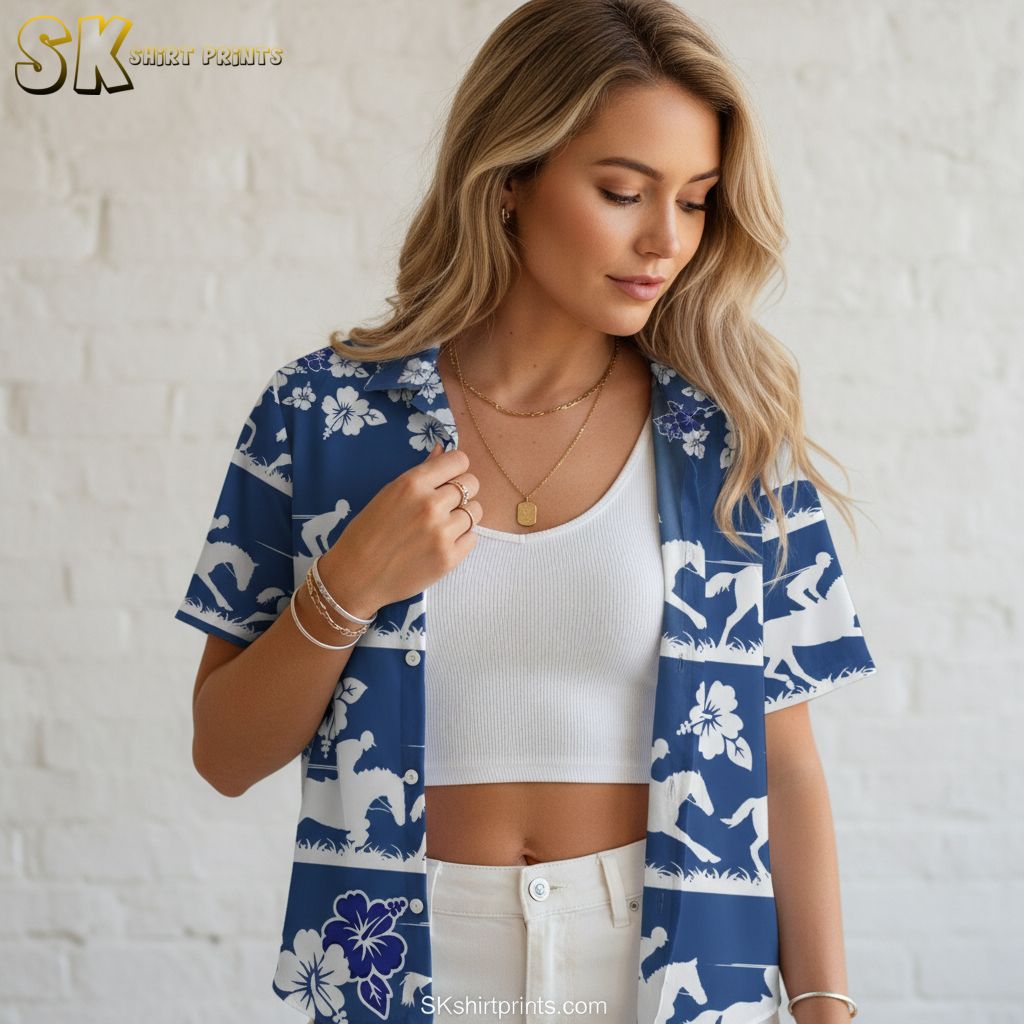 Mens blue hawaiian shirt displaying horse and rider silhouettes with hibiscus flowers in horizontal band design