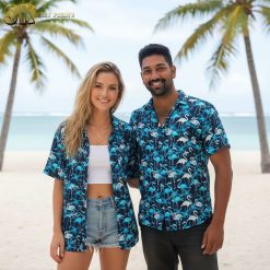 Mens blue Hawaiian shirt with flamingo pattern and tropical foliage in white and black details