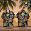 Men's blue Hawaiian shirt featuring pineapples wearing sunglasses with tropical flowers and leaves