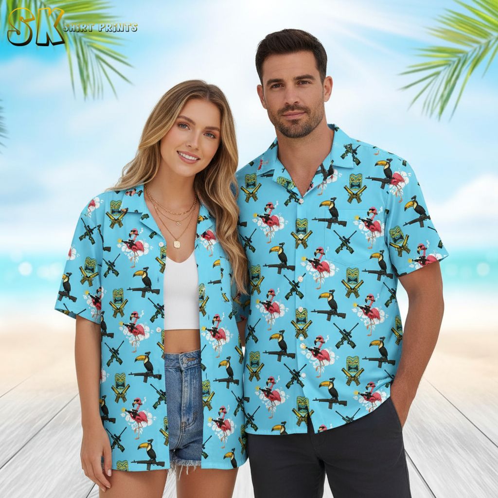 Mens blue hawaiian shirt displaying toucans on rifles with flamingo and tiki mask elements