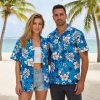 Mens blue hawaiian shirt with white hibiscus flowers, tropical leaves, and turtle graphics on blue background