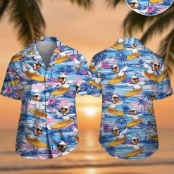 Men's Donald Duck Hawaiian shirt featuring cartoon ducks surfing on yellow surfboards with palm trees and ocean waves