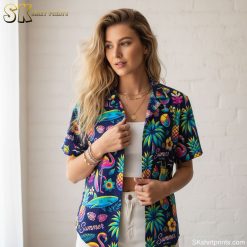Mens purple Hawaiian shirt displaying summer theme with pineapples, beach balls, cocktails, flamingos and tropical flowers