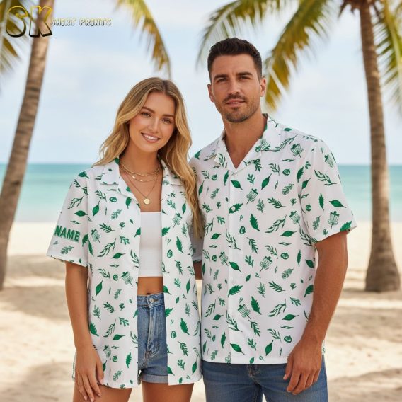 Mens white Hawaiian shirt displaying green tropical leaves and natural motifs
