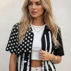 Military Hawaiian shirt combining American flag stars with tactical weapon graphics in monochrome
