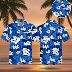 Navy blue Hawaiian shirt featuring scattered white plumeria flowers with yellow centers in tropical pattern
