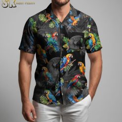 Patriotic Hawaiian shirt closeup showing detailed colorful parrots and tropical leaves pattern on black fabric