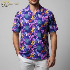 Purple aloha shirt displaying Bird of Paradise flowers in orange and yellow with purple tropical foliage