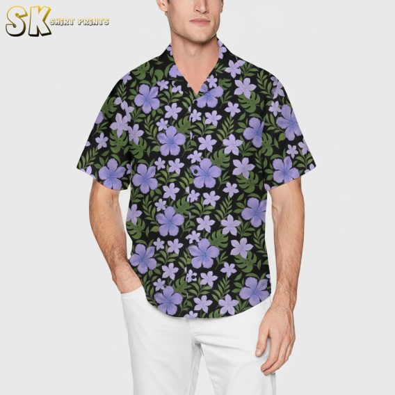 Purple aloha shirt displaying colorful floral motifs with green leaves against dark background