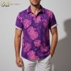 Purple aloha shirt displaying large pink monstera leaves and tropical foliage design