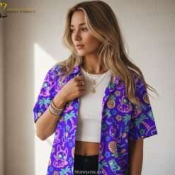 Purple and gold Hawaiian shirt showcasing surfboards, tropical patterns, and bright gold accents