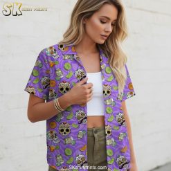 Purple Hawaiian shirt showcasing decorative sugar skulls with floral elements and margarita glass motifs