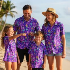Purple flower Hawaiian shirt displaying tropical flowers mixed with pineapples and palm tree designs