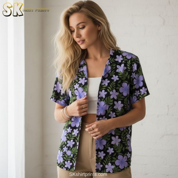 Purple flower hawaiian shirt with multiple purple blooms and green foliage creating tropical pattern