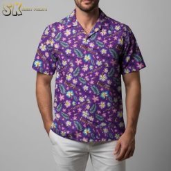 Purple Hawaiian shirt with tropical floral pattern featuring hibiscus flowers and fern leaves