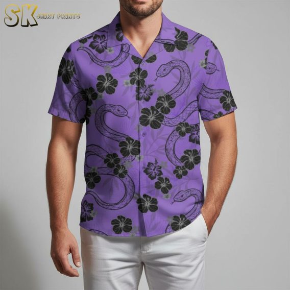 Purple hawaiian shirt displaying intertwining black snakes with hibiscus flowers on purple fabric