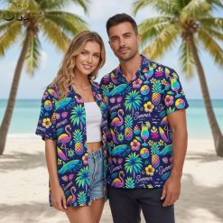 Purple tropical shirt with flamingo and pineapple print featuring beach balls, cocktails and palm leaves in bright colors