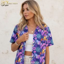 Purple tropical shirt showing tropical leaves in purple and blue with colorful flower accents
