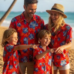 Red and blue Hawaiian shirt styled for casual wear showing hibiscus floral print and vibrant colors